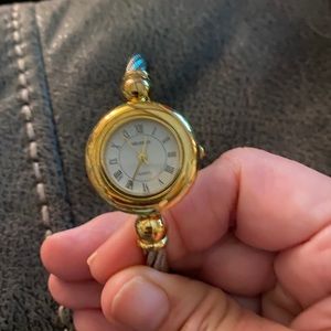 Silver and gold tone bangle style watch